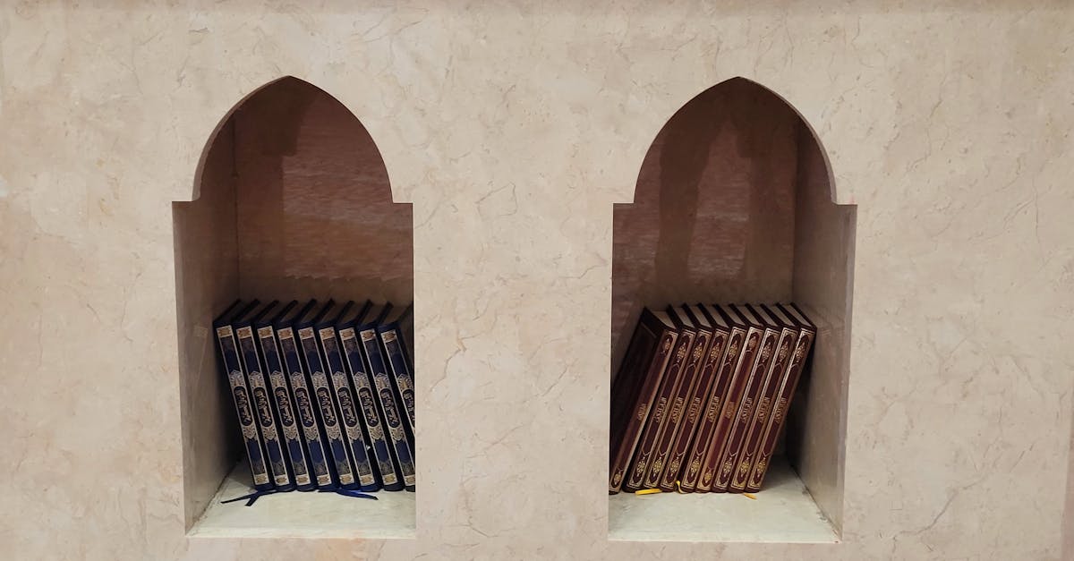 A symmetrical display of Quran books in an arched niche at a mosque in Duschanbe, Tajikistan.